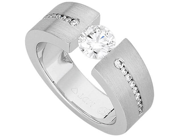 A sparkling white gold Tension Set Round Diamond Ring With Tapered Diamonds Band C845 engagement ring with a round diamond set in the center.