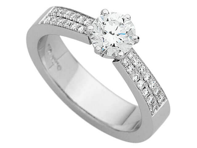 A White Gold Claw Set Round Diamond With Diamonds Band C860 engagement ring with a brilliant cut diamond and round diamond.