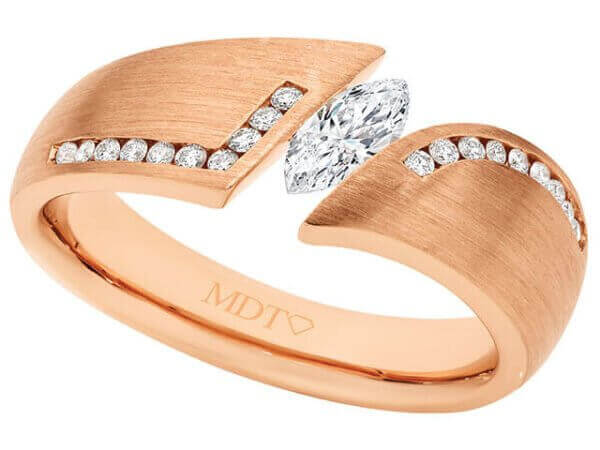 A Rose gold flared tension set engagement ring C746, showcasing a marquise cut diamond.