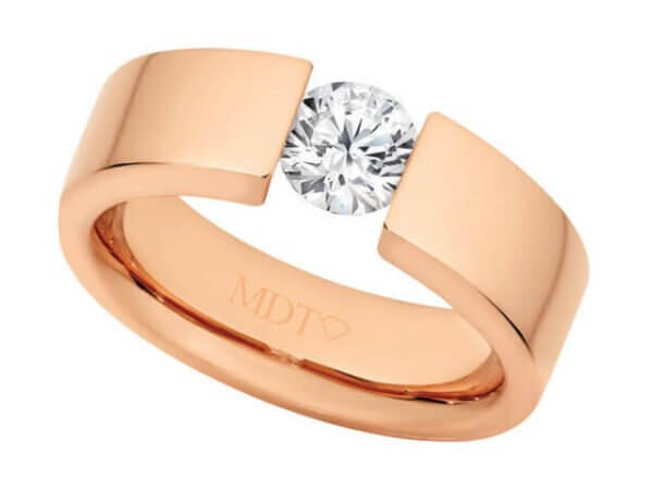 A Rose Gold Tension Set Ring C364 with a round cut diamond, which sits elegantly in the tension set.