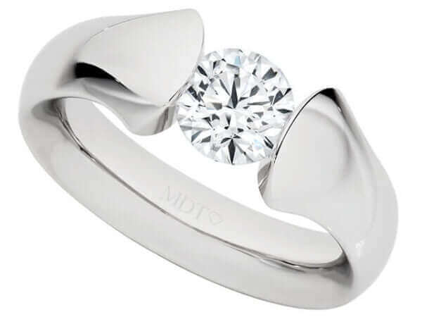 A Platinum tension set engagement ring C1026 crafted in platinum with a round cut diamond.