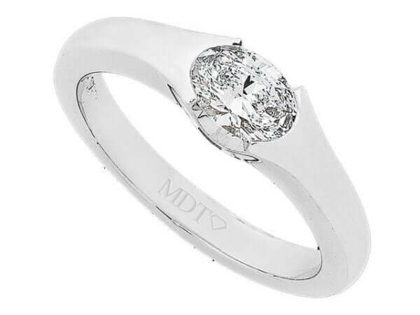 An Half Bezel Set Oval Shaped Diamond Ring C823 with a diamond.