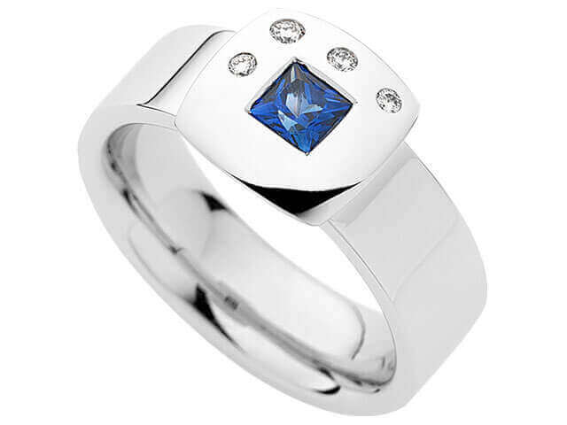 A white gold ring with a Princess Cut Sapphire & Diamond Ring C739.