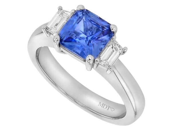 A Blue Sapphire Trilogy Engagement Ring C760 with diamonds.