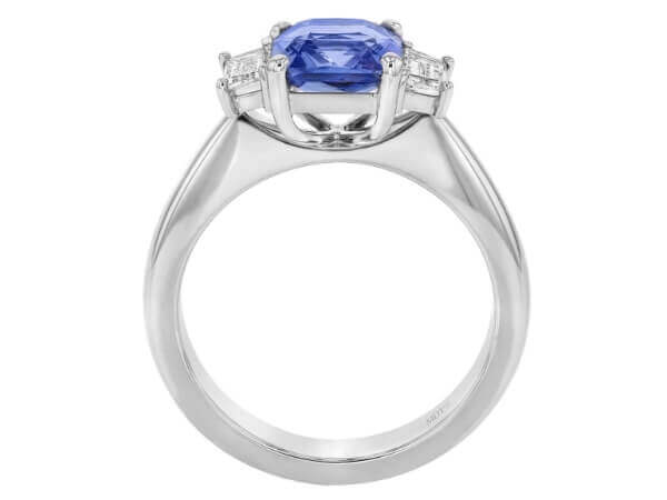 A Blue Sapphire Trilogy Engagement Ring C760 adorned with diamonds.