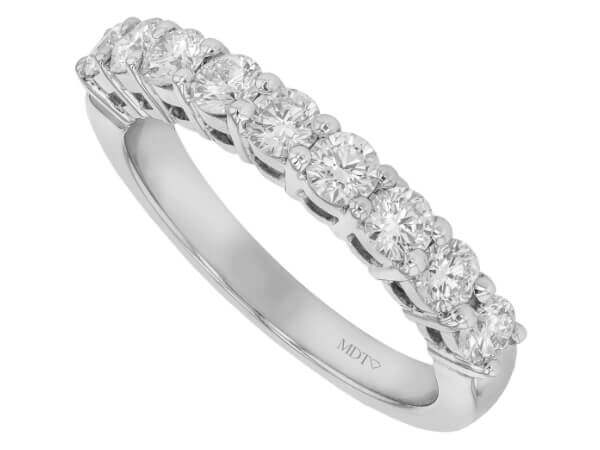 A Ladies Claw Set Diamond Wedding Ring C579 adorned with round diamonds.