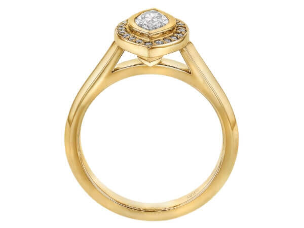 A stunning Marquise Diamond Halo Engagement Ring C1011 with a yellow gold band and a diamond halo.