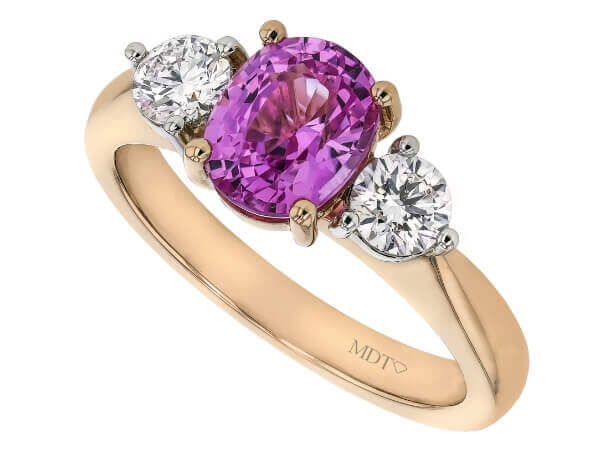 An Oval Pink Sapphire and Diamond Trilogy Engagement Ring C1202.