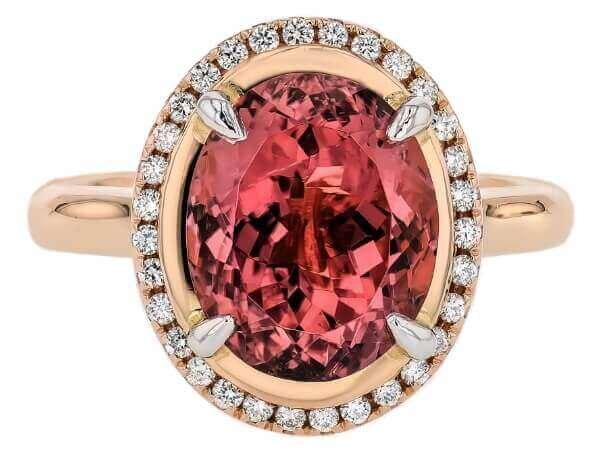 A stunning oval Pink Tourmaline and Diamond Halo Engagement Ring C1249 with a diamond halo.