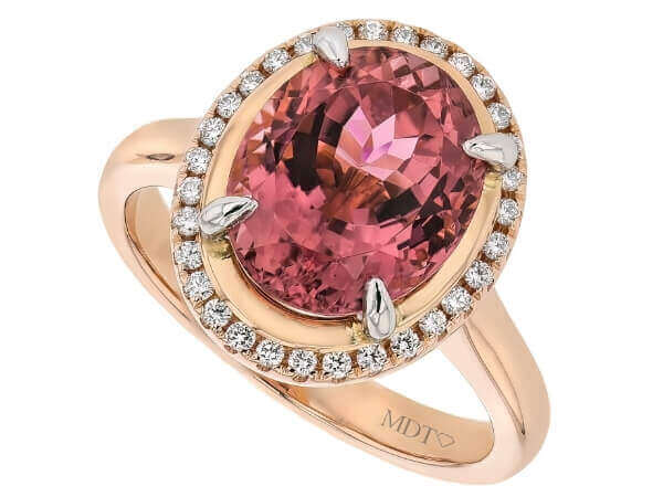 A stunning oval Pink Tourmaline and Diamond Halo Engagement Ring C1249.