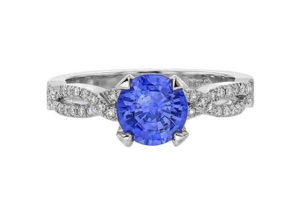 Sapphire diamond engagement ring on white background.