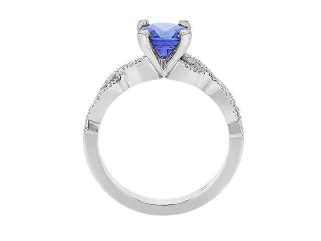 Blue gemstone engagement ring with diamond accents.